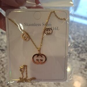 Luxurious Gold Necklace Set with Iconic Emblem